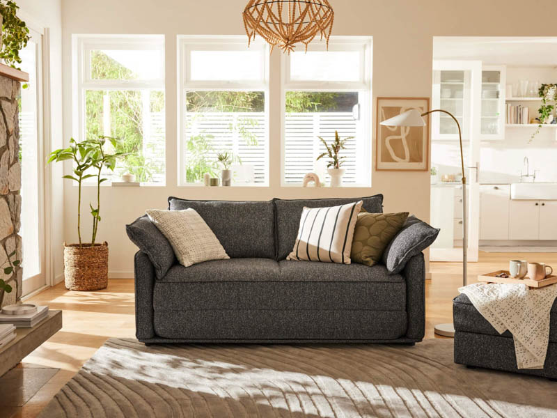 two seater sofa bed in light room