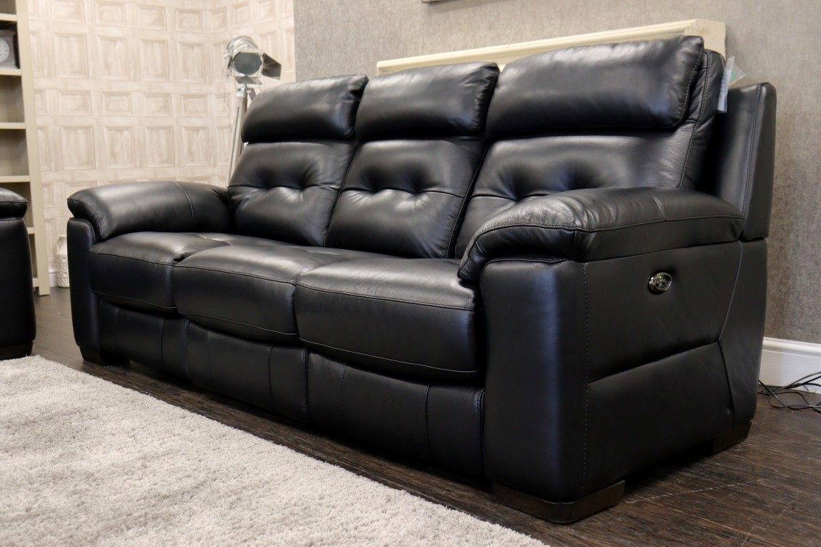 Black leather recliner sofa, a durable style suited to high-turnover rental properties.